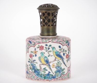 a small vase with a bird design on it