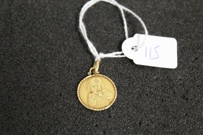 a close up of a coin on a string with a price tag