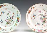 two plates that are decorated with flowers on them
