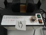 a picture of a small electronic device with a note attached to it