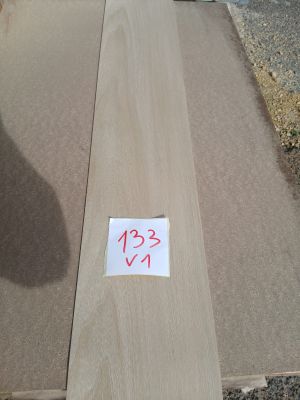 a piece of wood that has been cut and is sitting on the ground