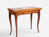 a small table with a wooden top and legs