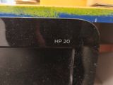 a close up of a black hp 20 computer on a desk