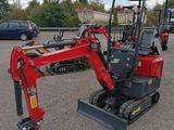 an image of a small red excavator parked in a parking lot