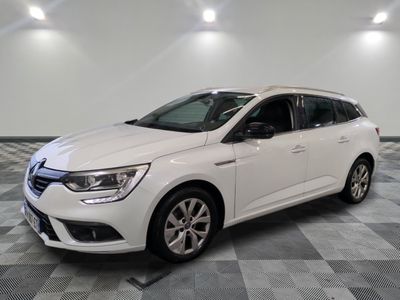 a white car parked in a room with a checkered floor