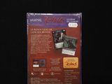 three boxes of vampire cards on a black surface with a black background