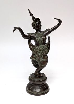 bronze statue of a woman holding a bird on a pedestal