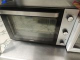 a toaster oven sitting on top of a counter