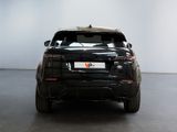 a picture of a black car parked in a showroom