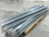 four pieces of gal steel nails are stacked on a wooden stand
