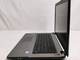 a laptop that is open on a white surface