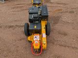 a small machine that is sitting in the dirt