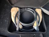 a suitcase with a hose in it sitting on the floor