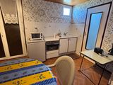 a small kitchen with a table and chairs in it