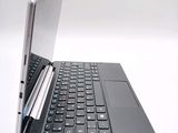 a laptop with a pen sitting on top of it
