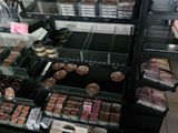 a display case filled with lots of different types of baked goods