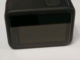 a black camera sitting on top of a white table