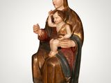an image of a statue of a woman holding a child