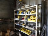 many tools on the shelves in the garage