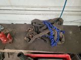a red fire hydrant and some chains on a table