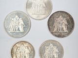 six different british coins, including one sovereign, one sovereign and one sovereign
