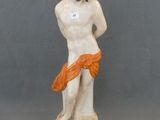 figurine of a woman with a red scarf on her head