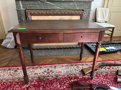 a table with a drawer on top of it in a living room