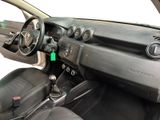 a car dashboard with a steering wheel and dashboard buttons