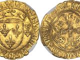 a gold coin with a coat of arms on it