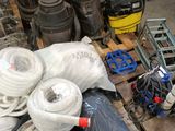 many different types of hoses on a pallet