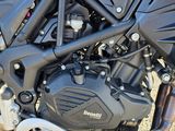 a close up of a motorcycle parked in a parking lot