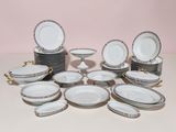 a lot of plates and bowls that are on the table