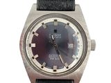 a watch with a black dial on a black leather strap