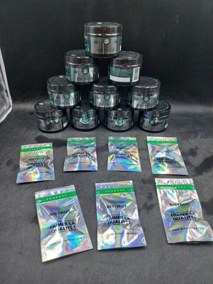 a pile of marijuana packets sitting on top of a table