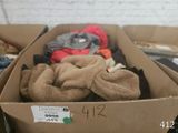 a cardboard box filled with a lot of clothes