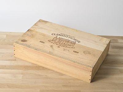 a wooden box that is sitting on a wooden floor