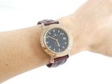 wrist shot of a person wearing a watch on their wrist