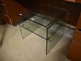 a glass table that is sitting on the floor