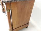a small kitchen island with a marble top