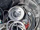 a trash can filled with wires and wires on the ground