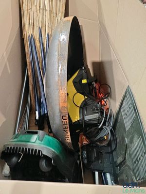 a box full of assorted items and tools in it