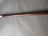 a baseball bat that is laying on a table