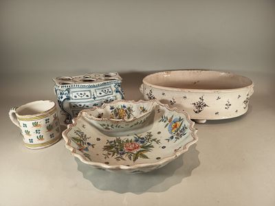 three bowls and two cups on a table