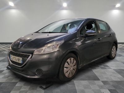 the grey car is parked in the garage on the checkered floor