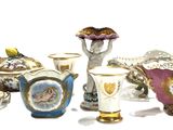 many different vases that are sitting on a white surface
