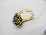 une image représentant une bague en or sertie d'une pierre turquoise