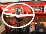 a steering wheel and dashboard of an old car
