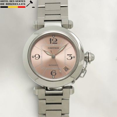 a close up of a wrist watch on a white surface