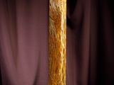 a tall piece of wood that is sitting on a table