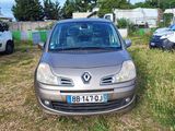 a silver car that is parked in the grass